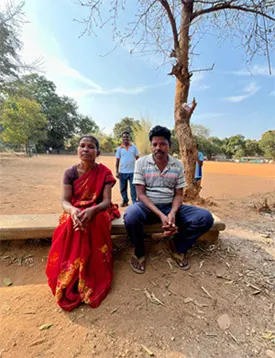 Roshni Bhengra, 33, and Turang Bhengra, 46, with grassroots mentor Hemant Aind (centre), whose early training at the Uyur hockey centre helped shape their daughter Nupur&rsquo;s journey. *