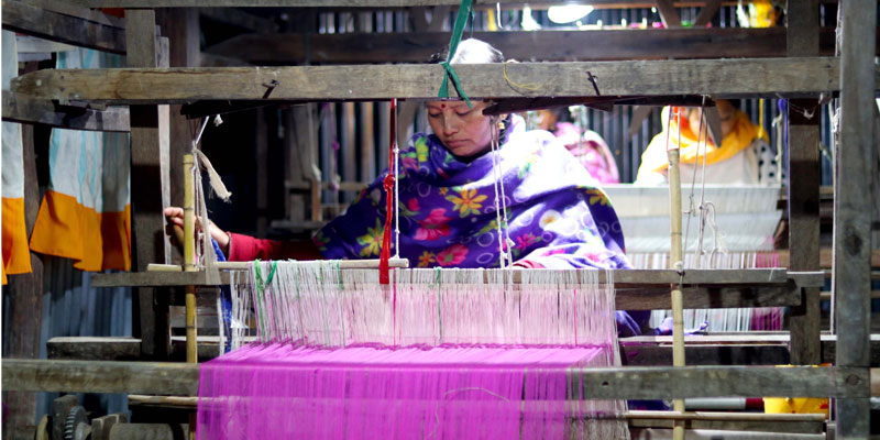 A beneficiary working on a loom powered by solar energy in the project area of SEVA in Manipur A beneficiary working on a loom powered by solar energy in the project area of SEVA in Manipur