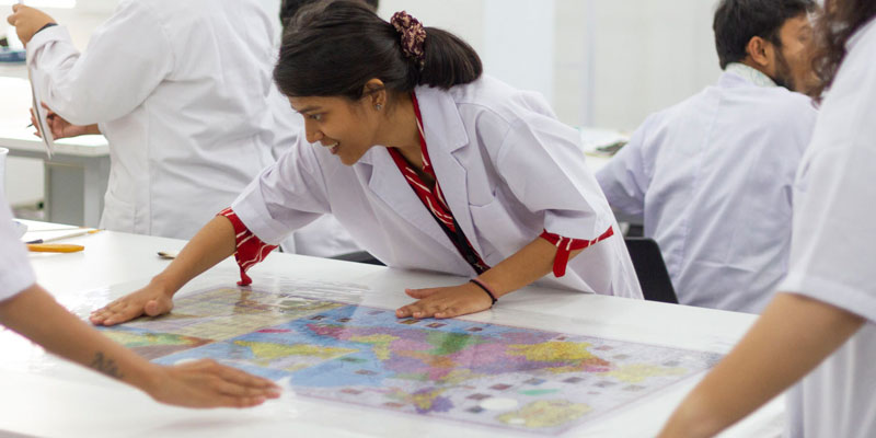 Participants undertaking lining of maps during the Conservation of Paper &ndash; II (Prints, Maps & Drawings) training course