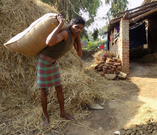 Asharam with a heavy sack on his back during his early days as a migrant labour Asharam with a heavy sack on his back during his early days as a migrant labour
