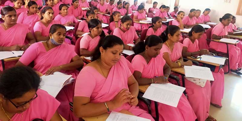 ASHAs take down detailed notes on the use of the ASHA app
