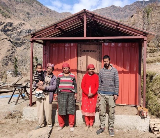 Khube Ram’s family outside their new insulated shelter.