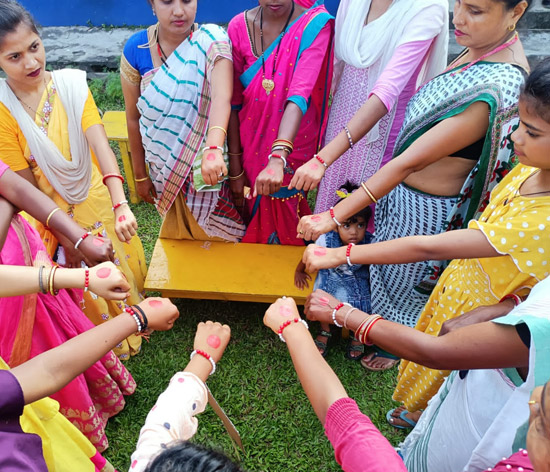 The activity involves women displaying wristbands and red dots on their hands with the aim of challenging social taboos and stigmas surrounding menstruation The activity involves women displaying wristbands and red dots on their hands with the aim of challenging social taboos and stigmas surrounding menstruation