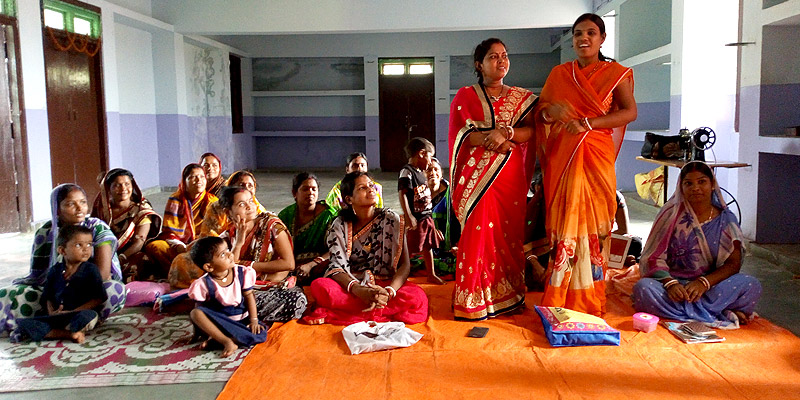 Women expressing their concerns at a local meeting