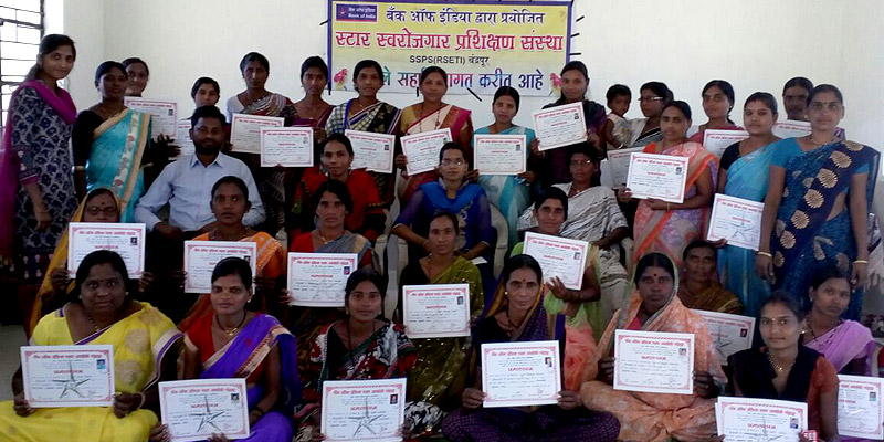 Participants showing their certificates after completing a vocational training