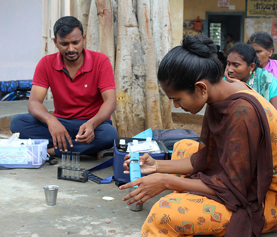 Demonstrating water testing to the community Demonstrating water testing to the community