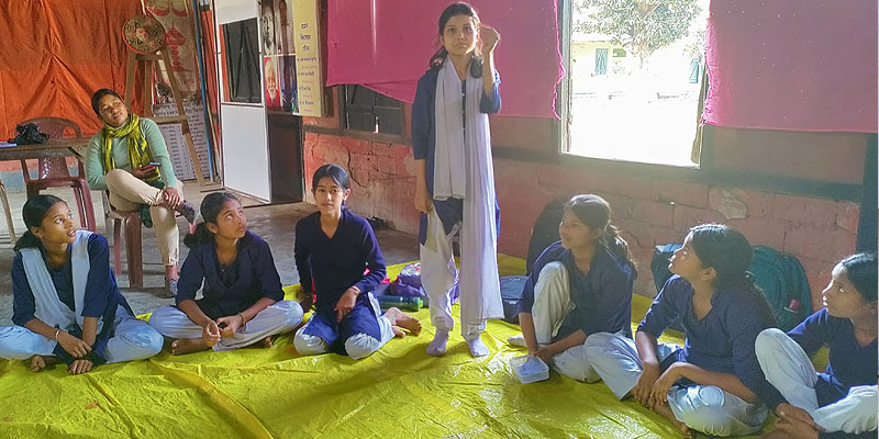 Jayshree and other girls discussing about menstrual products