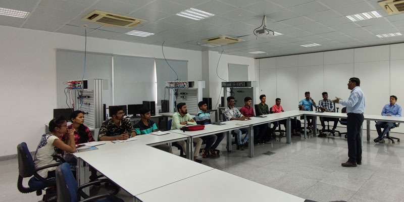 Anjali attentively listening to her instructor