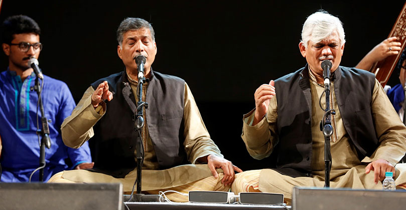 The Gundecha brothers (L) Late Shri Ramakant Gundecha and (R.) Shri Umakant Gundecha performing with their  students at Tata Trusts' Kalapana Arts Festival in 2017