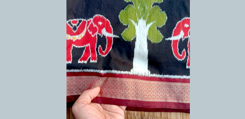 The bright colours and tight weaves of a traditional handloom saree