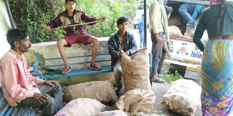 : Villagers of Bandal Ghati sending their produce to the cooperative's storage facility