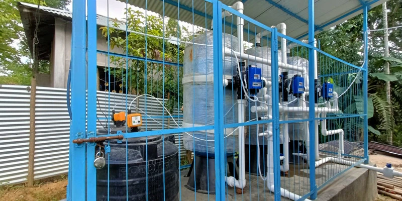 Halahali IRP site set against a rural backdrop, supplying treated water to surrounding households.