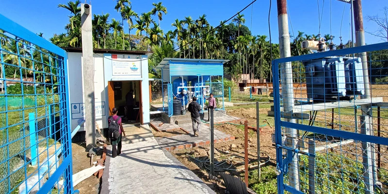 Community members gather near the IRP site, reflecting local engagement and ownership in water management.