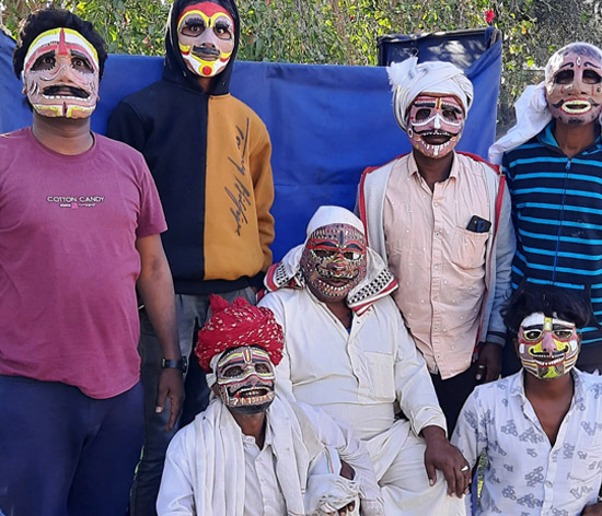 Masked artists, trained by CmF, deliver the WaSH campaign's key messages through their performance at a habitation in south Rajasthan