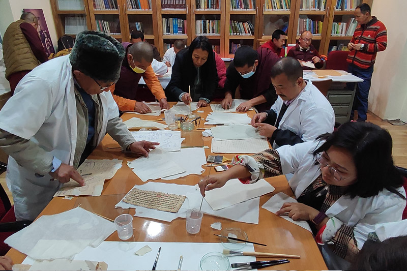Participants undertaking emergency repairs of paper documents