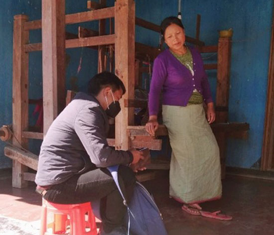 Ms Memtombi and her husband at their weaving workshop in Manipur