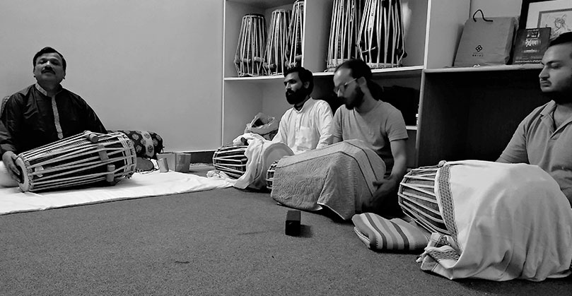 A pakhawaj (percussion) class in progress