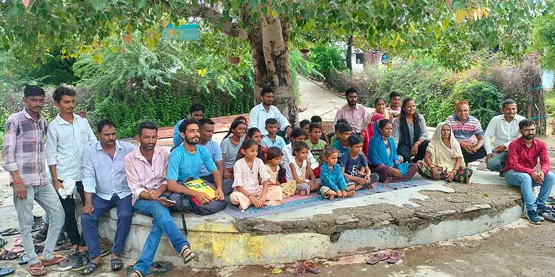 Villagers attending the monthly meeting of the WSC