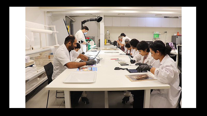 Participants engaged in different activities -identifying photographic materials and carrying out basic emergency repairs, during the offline workshop at MAP, Bangalore