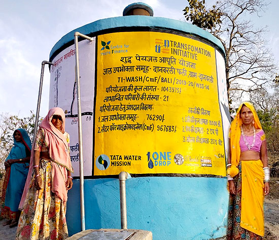 Pappi Bai and Badali Bai alongside the new water tank at Danverli Fali