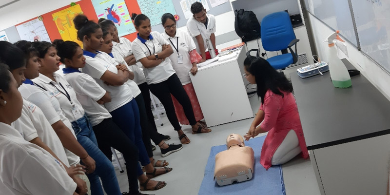 A Tata STRIVE instructor gives a live CPR demonstration