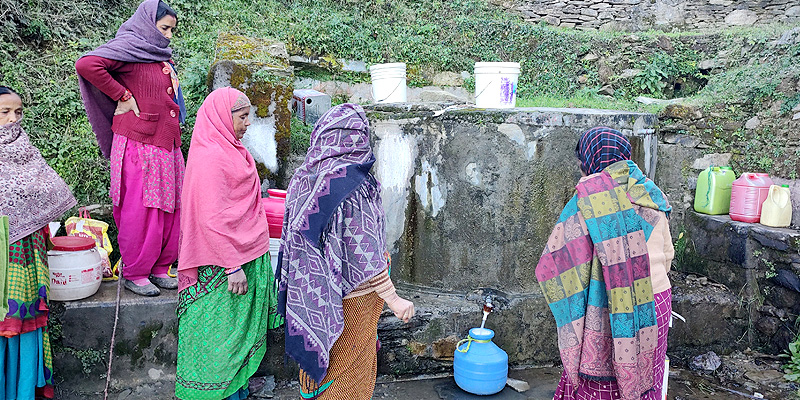 Women in Majyad Gaon filling water from the natural source