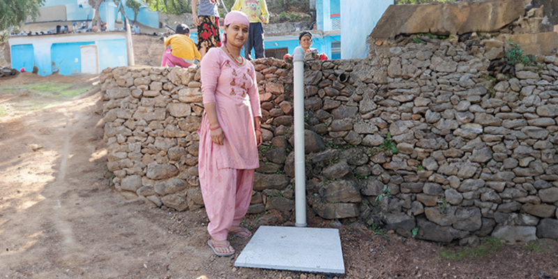 Beneficiary Priyanka Devi next to the soak pit for her house in Kemriya Saur vilage, of Garhwal district, Uttarakhand