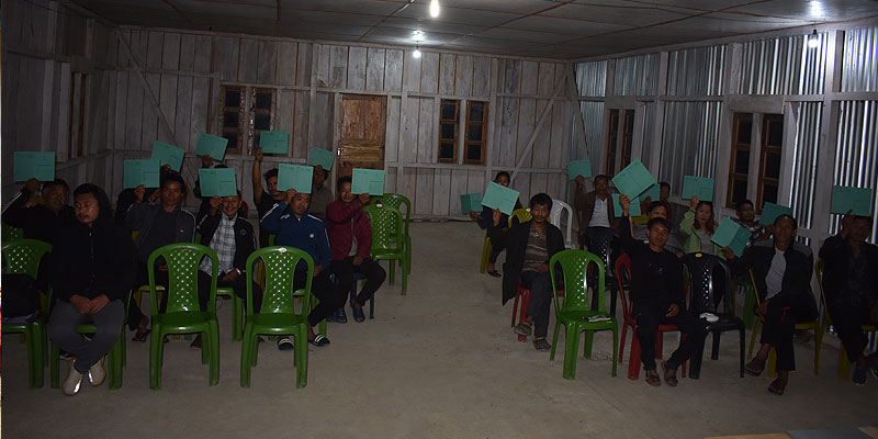 Residents of New Chingmei village holding the Water Service Fee card
