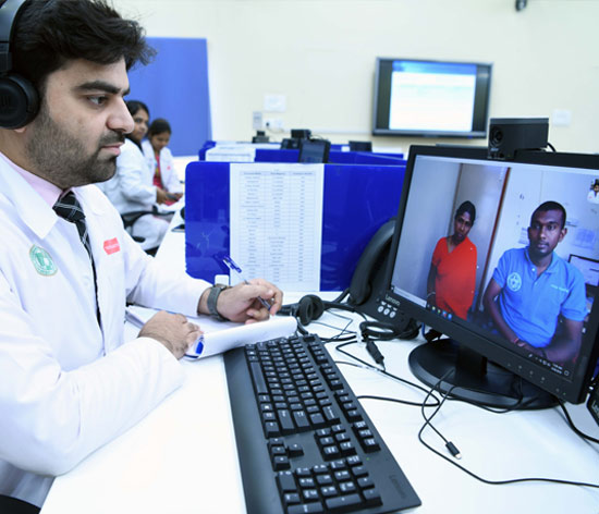 A doctor at the hub provides medical advice to a patient