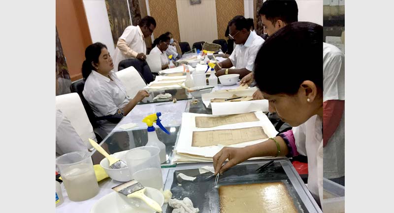 Police conservation team at work at the Mumbai Police Archives_Image credit_Gayatri Kamath (Tata Trusts Horizons Magazine)