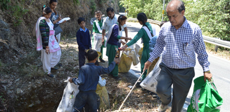 Students from the local school participating in a clean-up drive