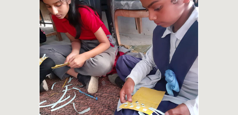 Local children and those from the MIS school busy in a craft workshop