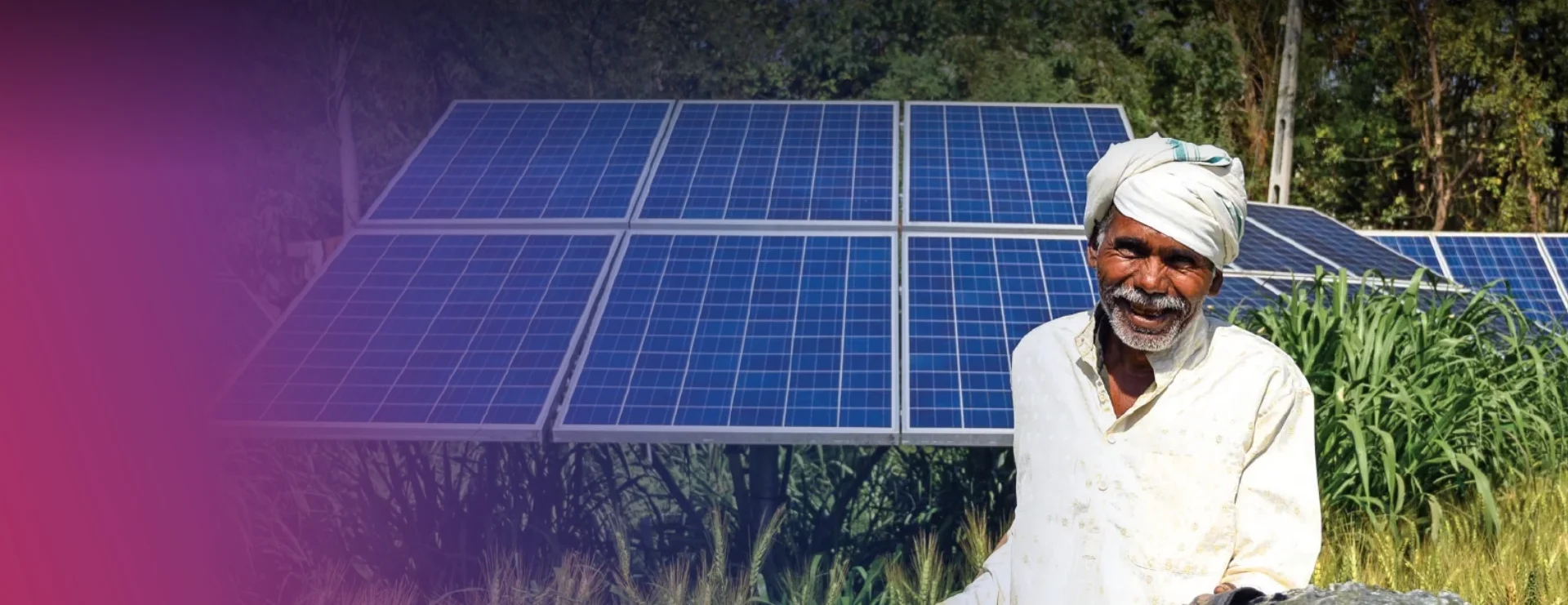 Farmer beside solar panels, representing a sustainable future