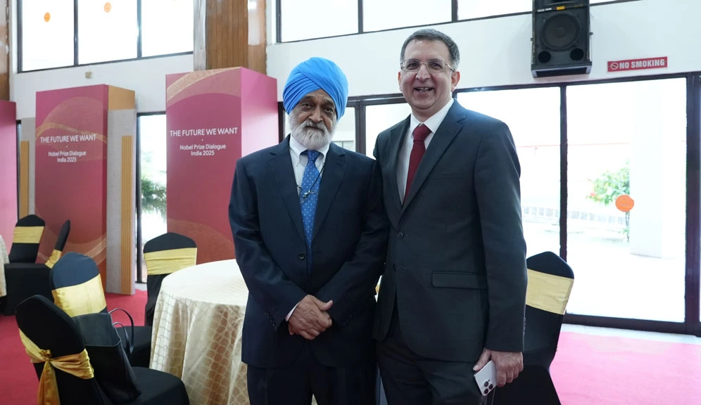 Siddharth Sharma, CEO of Tata Trusts, shares a light moment with Montek Singh Ahluwalia during the Nobel Prize Dialogue India 2025.