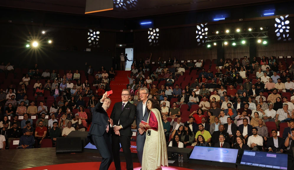 The event concluded with a commemorative selfie featuring (from left) Owen Gaffney, Nobel Laureates James Robinson and David MacMillan, and Shilpi Ghosh — with the audience in the auditorium still abuzz with energy.