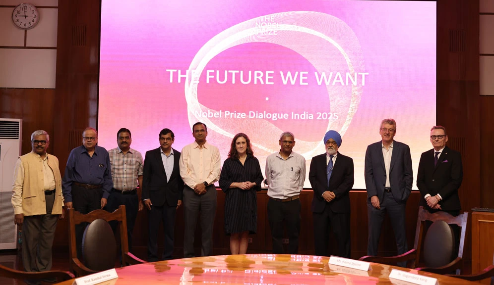 Ahead of the event, from left: IISc Professors Satyam Suwas, Jayant Modak, Govindasamy Mugesh, SK Satheesh, and Rajesh Sundaresan; Hanna Stjärne, Nobel Foundation; Jayaram Chengalur, TIFR; Montek Singh Ahluwalia, economist; and Nobel Laureates David MacMillan (chemistry 2021) and James Robinson (economic sciences 2024) — pose for a photograph at IISc.