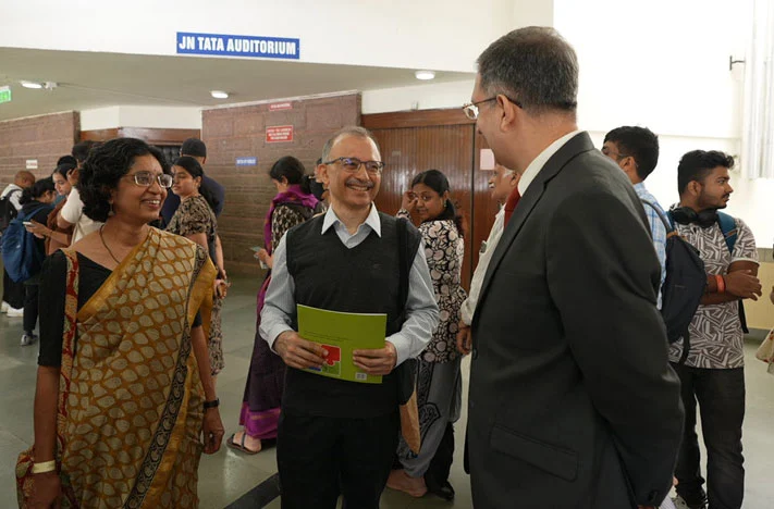 Siddharth Sharma (right), CEO of Tata Trusts, interacts with Harish Bhat and Veena Bhat at the Parag Collab Art Wall booth during the Nobel Prize Dialogue India 2025 in Bengaluru on November 3, 2025.