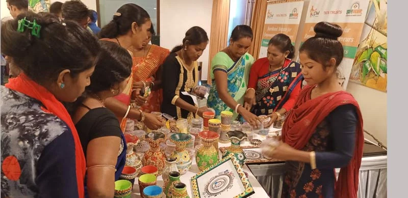 Women entrepreneurs displaying lac products.