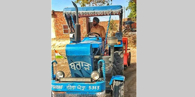 Brar on his tractor at his farm in Maluka, Bathinda.
