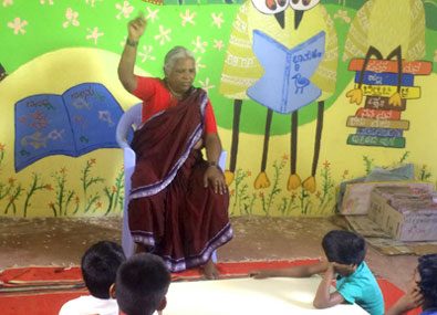 A teacher enthrals the students with her storytelling skills A teacher enthrals the students with her storytelling skills