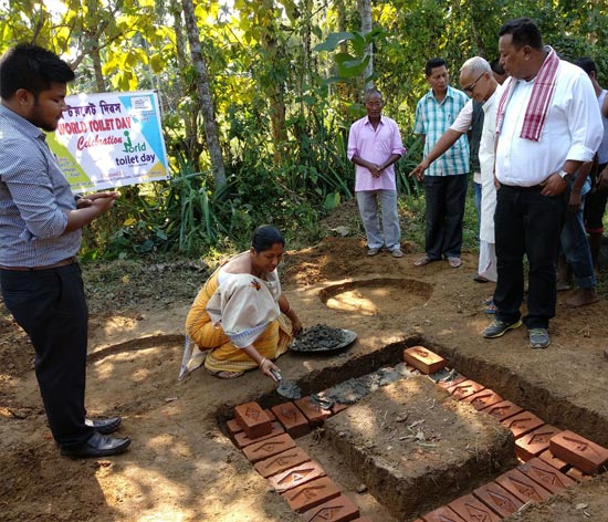 Dudhnoi gram panchayat president performing shramdaan (voluntary labour) to construct a toilet Dudhnoi gram panchayat president performing shramdaan (voluntary labour) to construct a toilet