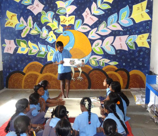 A student enthusiastically shares his work of creativity
